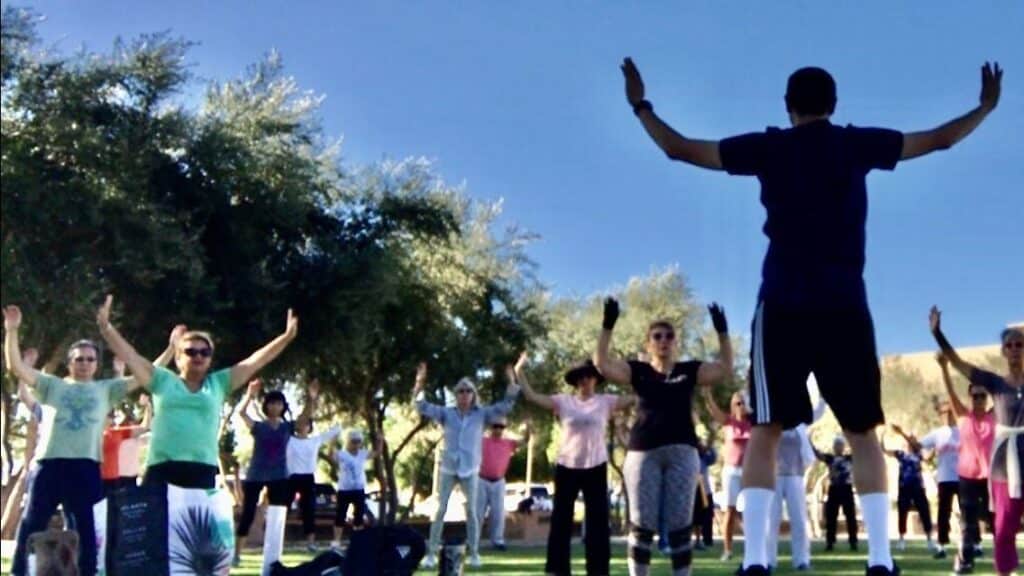 Ryan Lee teaching group qigong exercise